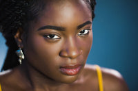 Close-up of a woman with a blue background