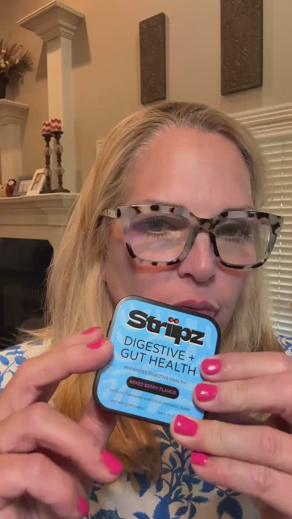 Woman showcasing Striipz Gut Health dietary supplement in a lifestyle video