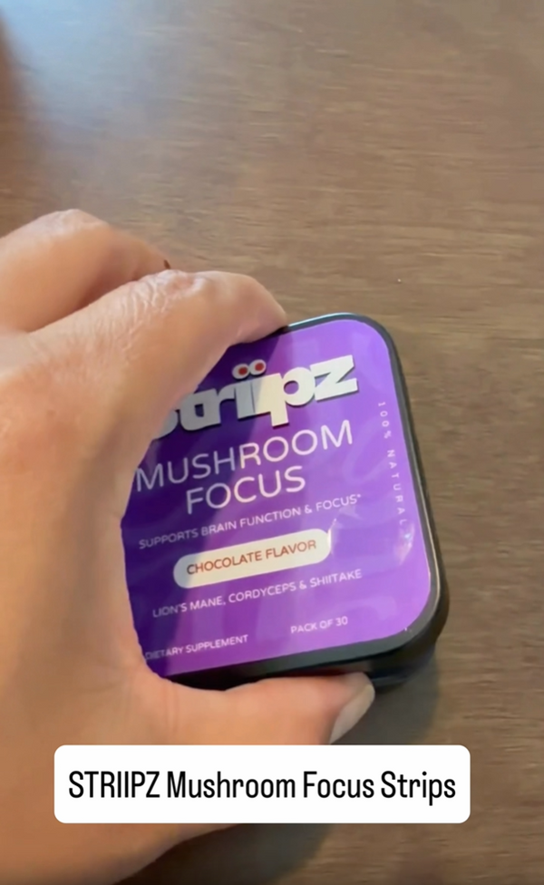 Woman working at a desk with a Striipz Mushroom Focus chocolate-flavored supplement